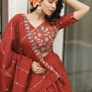 drape in our radiate elegance in this rust fenta textured silk lehenga featuring vertical sequin accents and a heavy, multi colored floral pipe bead style embroidered. perfect for weddings and special occasions, this designer lehenga blends luxury, tradition, and timeless elegance