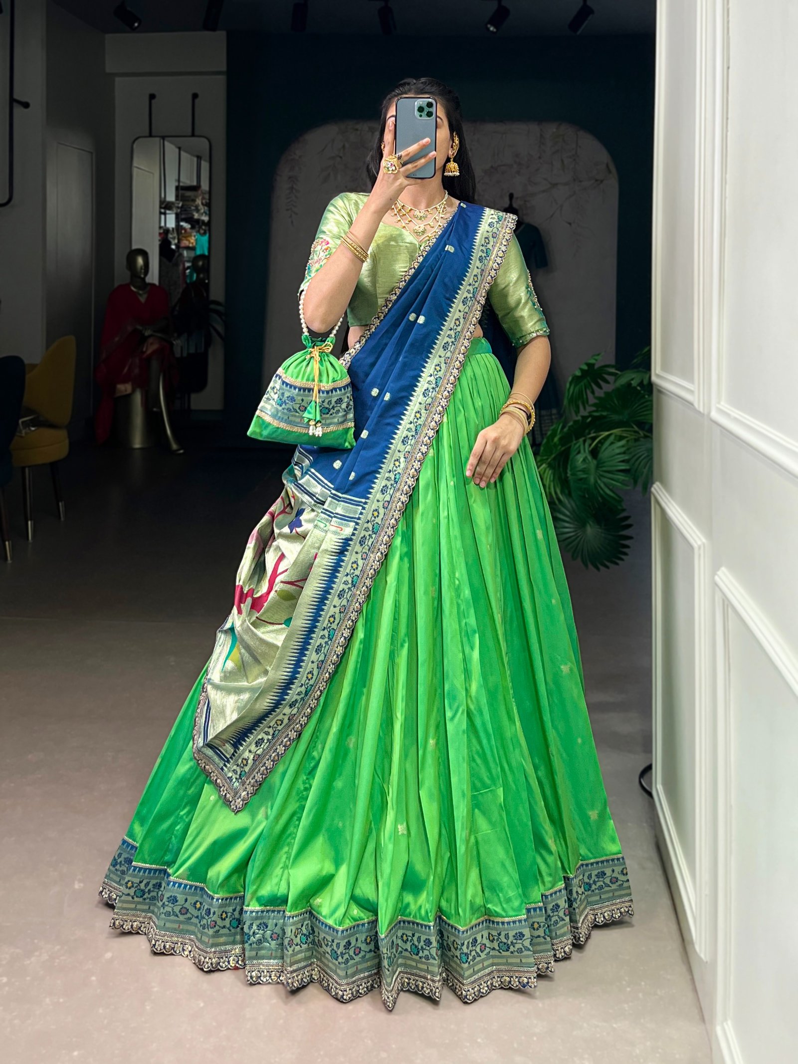 draped in refreshing shades of green, this soft silk lehenga choli shines with intricate zari weaving, delicate sequins, thread embroidery, and an elegant scallop lace border draped in refreshing shades of green, this soft silk lehenga choli shines with intricate zari weaving, delicate sequins, thread embroidery, and an elegant scallop lace border