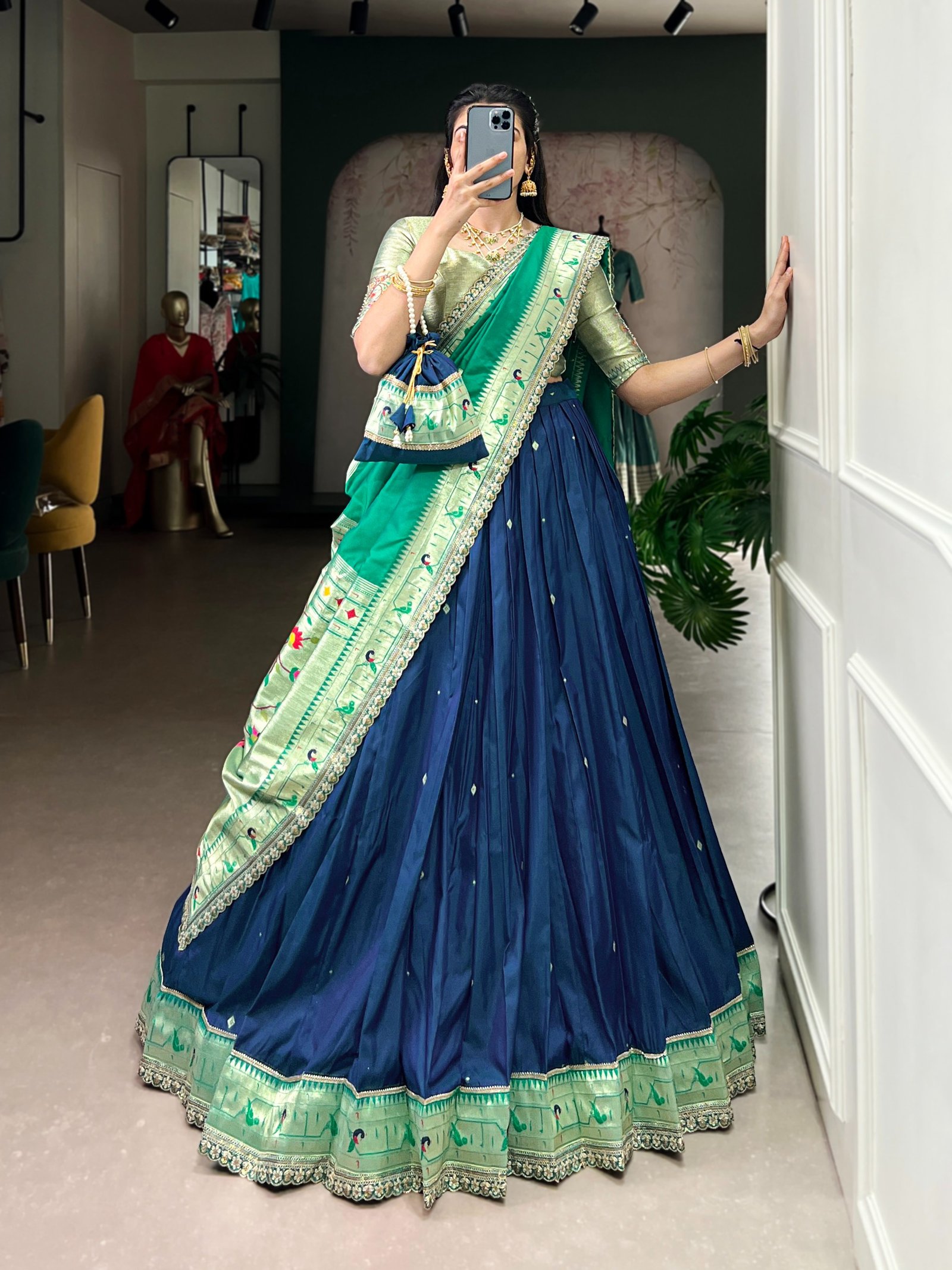 draped in refreshing shades of green, this soft silk lehenga choli shines with intricate zari weaving, delicate sequins, thread embroidery, and an elegant scallop lace border draped in refreshing shades of green, this soft silk lehenga choli shines with intricate zari weaving, delicate sequins, thread embroidery, and an elegant scallop lace border