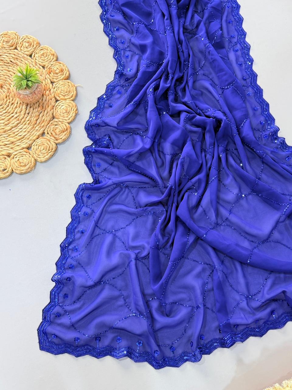 pure georgette saree with fully heavy bits sequence work all over saree and designer scalp border pure georgette saree with fully heavy bits sequence work all over saree and designer scalp border