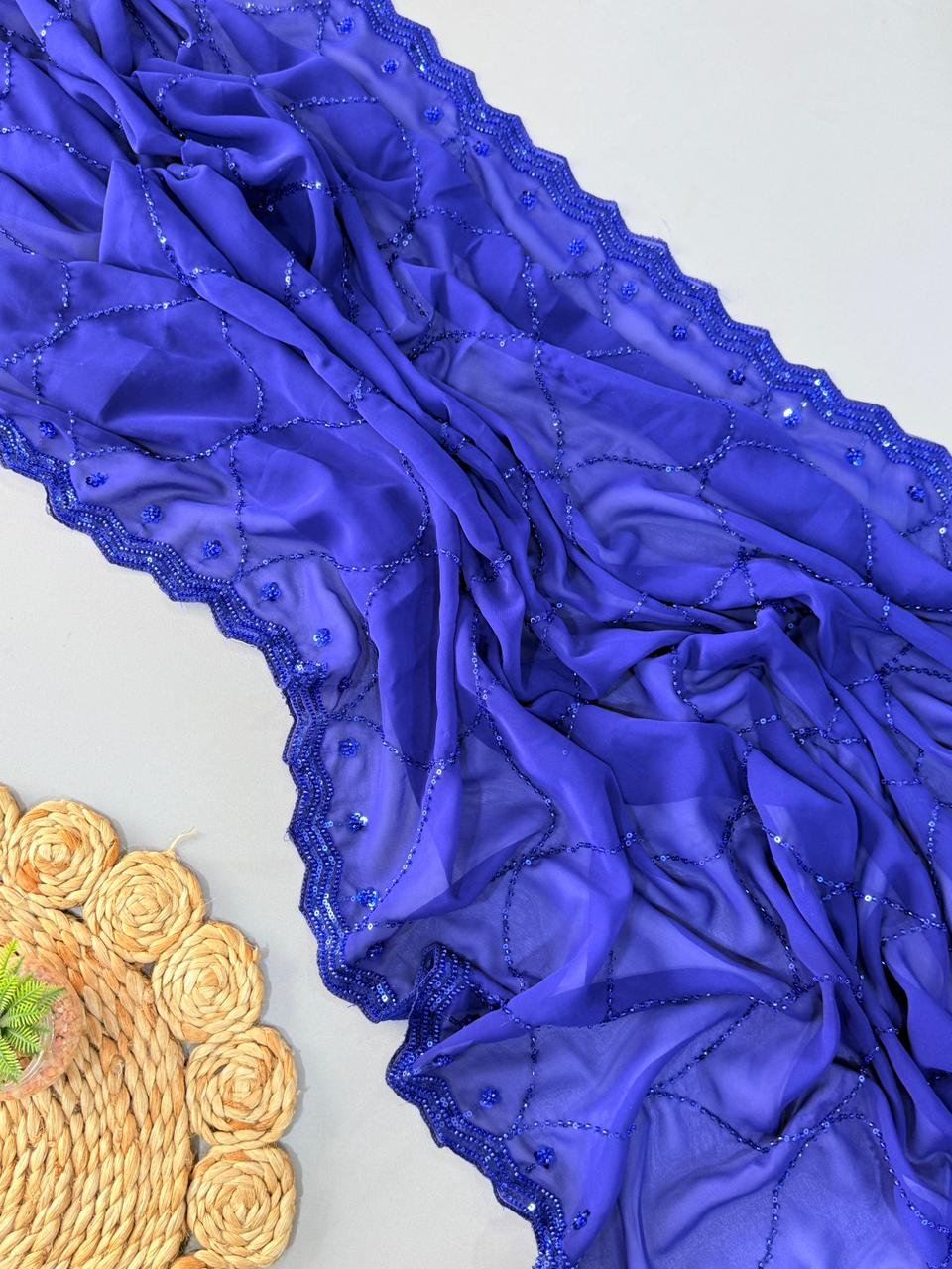pure georgette saree with fully heavy bits sequence work all over saree and designer scalp border pure georgette saree with fully heavy bits sequence work all over saree and designer scalp border