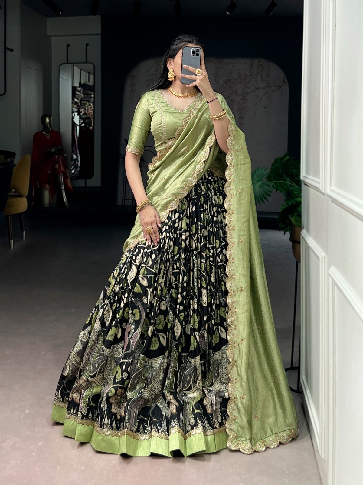 premium tasar silk, detailed kalamkari prints, and an embroidered dupatta, this lehenga set is a perfect choice for refined festive styling. premium tasar silk, detailed kalamkari prints, and an embroidered dupatta, this lehenga set is a perfect choice for refined festive styling.