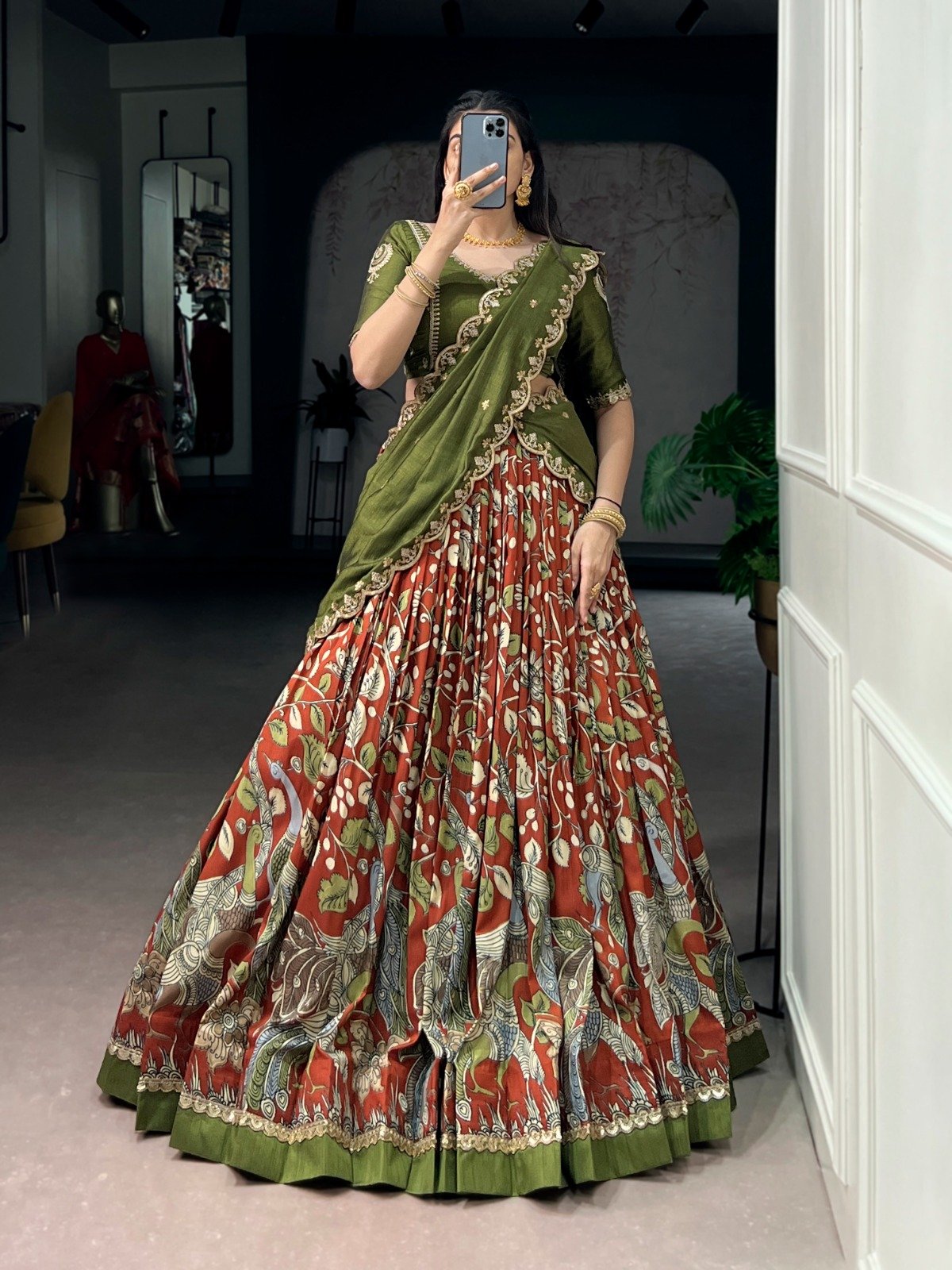 premium tasar silk, detailed kalamkari prints, and an embroidered dupatta, this lehenga set is a perfect choice for refined festive styling. premium tasar silk, detailed kalamkari prints, and an embroidered dupatta, this lehenga set is a perfect choice for refined festive styling.