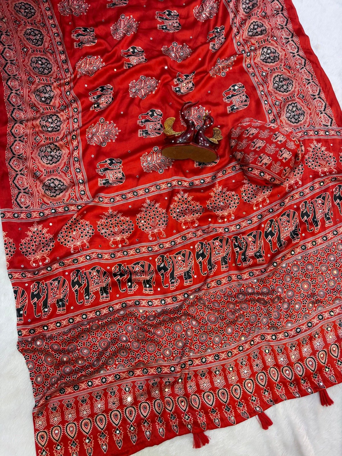 presenting most demanding saree heavy japan satin ajarakh print with real mirror work and latkan presenting most demanding saree heavy japan satin ajarakh print with real mirror work and latkan